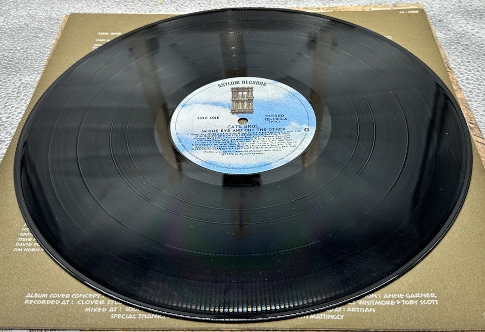 Cate Bros. - In One Eye And Out The Other Record In Good Condition 6802