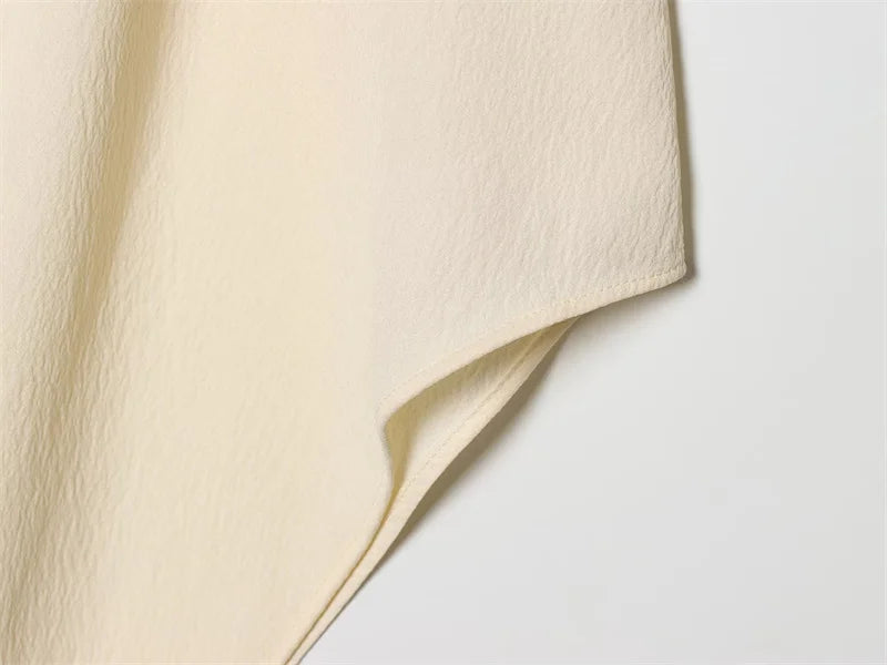 Women's Top 2026 Spring New Style Ivory Halter Neck Asymmetrical Hem Simple Sexy Backless Top Elegant and Stylish Personality