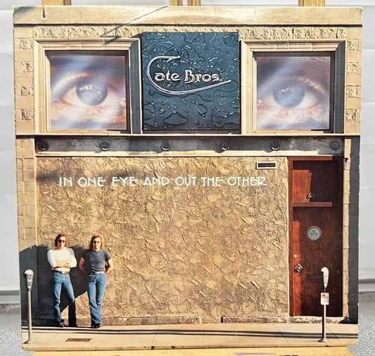 Cate Bros. - In One Eye And Out The Other Record In Good Condition 6802