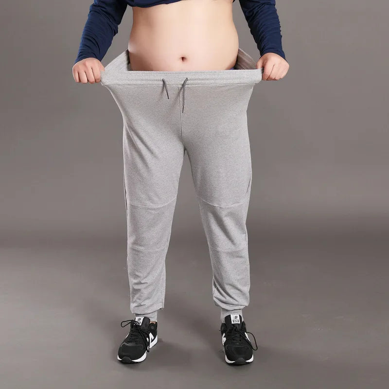Men Big Size Solid Sweatpants Spring Elastic Narrow Feet Stretch Pants Loose Plus Size Casual Cotton Jogger Trousers 5XL 6XL 7XL