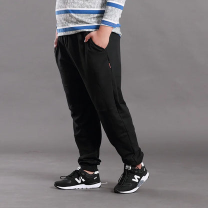 Men Big Size Solid Sweatpants Spring Elastic Narrow Feet Stretch Pants Loose Plus Size Casual Cotton Jogger Trousers 5XL 6XL 7XL