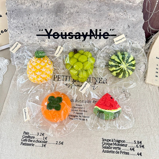 Five types of realistic fruit-shaped squeeze toys—perfect for cooling off in the summer: a watermelon slice, a whole watermelon,