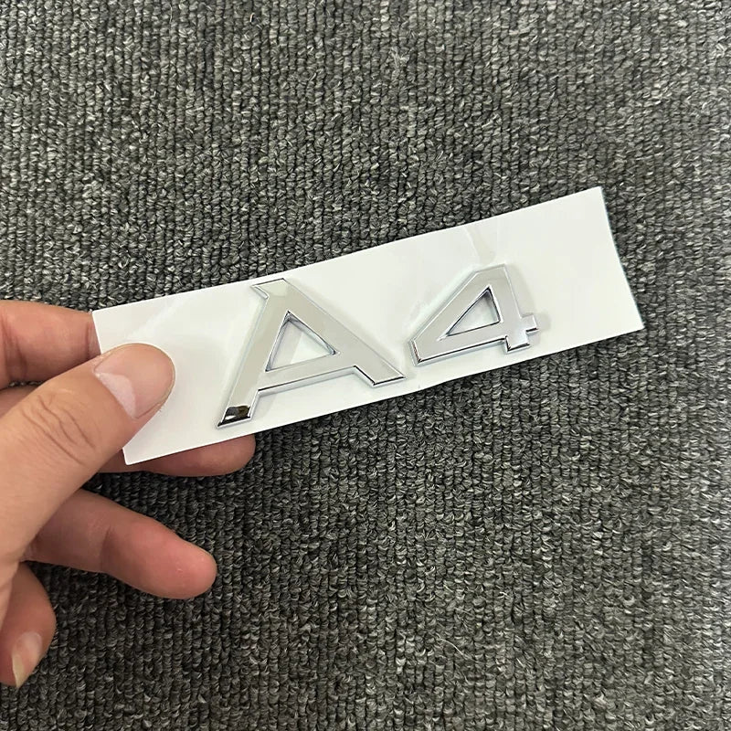 The new ABS letter 3D sticker Quattro Sline 2.0T is suitable for the modification of Audi A4 2008-2017 glossy black suitcase.