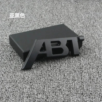 ABT-Style Gloss Black Rear Trunk Emblem - 1PCS Adhesive Badge Compatible with Audi A3/A4/A5/A6/A7/A8 & Q2/Q3/Q5/Q7 Models