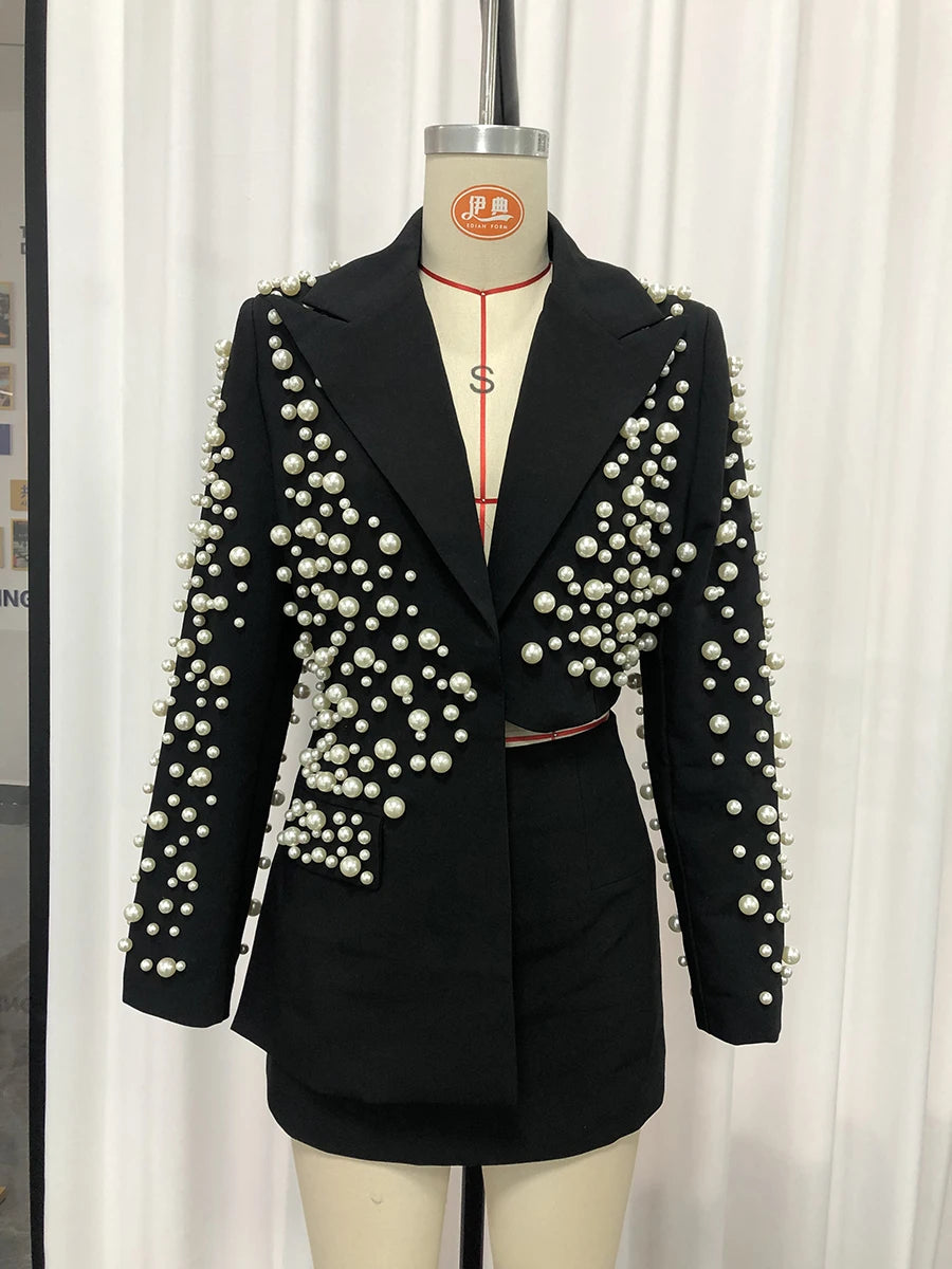TWOTWINSTYLE Spliced Pearls Two Piece Set for Women Lapel Long Sleeve Irregular Top High Waist Mini Skirt Office Suit Female New