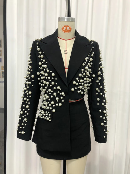 TWOTWINSTYLE Spliced Pearls Two Piece Set for Women Lapel Long Sleeve Irregular Top High Waist Mini Skirt Office Suit Female New