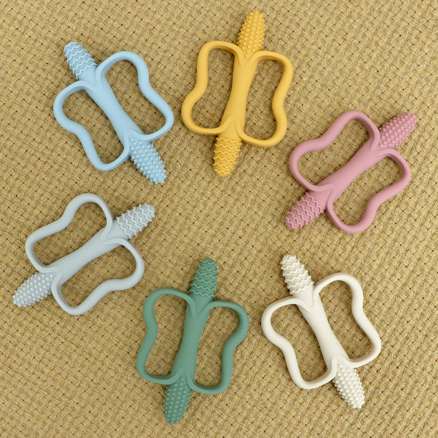 One-piece silicone teething stick with handle, baby toy teether, 6 colors, easy to grip, corn-shaped teether, BPA-free.